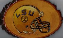 Wood burning of LSU helmet on Basswood plaque.
This picture was created using wood burning technique and paints. It is also protected with a thick polyresin finish and comes with a free display stand.