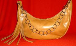 Gorgeous butterscotch colored vintage leather bag with unique metal chain loop strap & unusual leather tassel pull. Made in Pakistan for Lucian Piccard Leather of Distinction. Great condition, very gently used.
PayPal or Google Checkout accepted. I have a