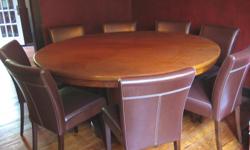 Super nice round wooden table on pedestal (Mahogany) - approx 70" from Manorisms + 8 brown leather chairs with white stitching.
Only used twice - once for Thanksgiving and once for a Poker Party. Great condition - set was over $4,000.00 new from Manorism