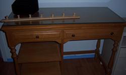 Maple desk with glass top. Call Diane at 443-570-0689.
