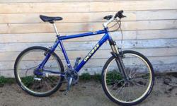 Large hardtail with LX and XT components. Manitou black adjustable front fork. Road tires. Looks and works well