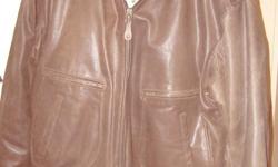 MEN?S LEATHER BOMBER JACKET
MEN'S BROWN LEATHER BOMBER (FLIGHT) JACKET, SIZE LARGE. Distressed 100% genuine leather (medium brown) with brown elasticized fabric at wrists and waist. Full-length front zipper. Back of jacket is plain with no patches. Two