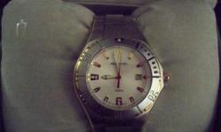 the watch was never worn, original box, battery operated