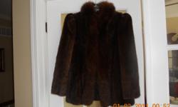 Beautiful Dark Brown Mink trimmed with Fox in front.
Hardly worn, great condition. Size 8 purchased from
fur company in Chicago. Only interested buyers please.