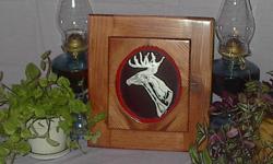 M001 (13x14.5?) $60.00 This mirrored wall plaque features the artwork of proud White Tail Deer Head and will accent any room. Hours of work taken to create this hand etched deer head, set on a mirror background to create depth. Elegantly framed with hand