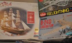 three model kits still in boxes. 3/4 scale balsa flying model p38 lightning. 1/28 scale non flying balsa model b24d liberator. 1/96 scale plastic model sea witch clipper ship. these are all large model kits. the aircraft have wingspans of 40 and 48 inches