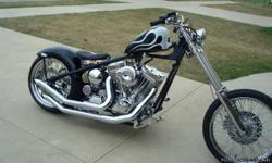 Custom Chopper with a 127 Cubic Inch Ultima chrome motor with a six speed transmission,and a 3 inch open belt drive , a 250 Avon chrome rear tire and a 21 inch Avon front wheel - 80 spoke wheels. Chrome forward controls, solo spring seat, chrome front