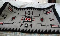 Beautiful Storm Pattern Navajo rug.&nbsp; Approx. size 4'x6'.&nbsp; Black, white, red & grey wool, very soft.&nbsp; purchased in the 1970's in the Gallup, NM area.&nbsp; What a wonderful gift this would make for someone that collects and appreciates