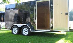 Features include:
24" front stone guard
Tandem 3500# 4" drop axles with electric brakes on all 4 wheels
15" White spoke wheels & tires
3/8" plywood walls - 3/4" plywood floor
Spring assisted rear ramp door
32" side door
Bargman 7 way electrical connector