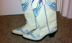 Brand New with tags designer Women's Cowboy boots. Size 6 1/2. Gorgeous and unique. Two for the price of 1.