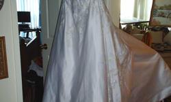 Brand New wedding dress beautifull satin white with three quarters of it beaded.
size 10-12 was $750.00 now $150.00 obo