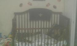 I have a brown wooden baby crib that needs to go ASAP! I bought it used, a little over a year ago. It has a few nicks and scratches but still in great condition! It is currently taken apart, ready to go. The pic below is the only pic I have at the moment.