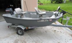 1994 Bass Tender Boat 10'2". Cozy Cove Aluminum Trailer. Newer 4 HP Yamaha 2 cycle engine also hand controled Minn Kota trolling motor. Live Well and Eagle Fish Mark fish and depth finder. Two swivel seat. Call EJ @ 402 650-2678