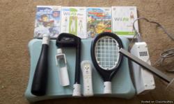 nintendo wii with balance board and 4 games has remote and other accesories.