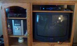Excellent condition, beautiful golden oak finish. Glass Doors on 1 side and storage compartment on bottom. Measures 50" wide x 48" tall x17' deep. Holds 25' TV. Asking $175. Also available; 25" Sharp color TV with great picture - asking $50. Please call