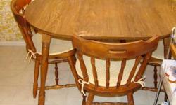 Nice kitchen table and 4 chairs with insert extension. With extension in table is 47" x 36". Extension is 11 1/2" wide. Veneer is oak style. Legs can be removed from table top. In good condition. Chair pads are not included. Email me for more pictures