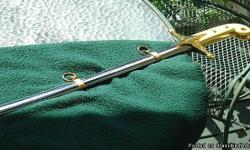 Sterling Silver sword with gold handle and brackets ? engraved ?United States Marines? and ?Oliver Lawrence North?.
Marine officers have 1 sword commissioned when they are in command of troops in formation.
For enlisted Marines, they earn the right to