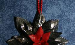 See ornaments are made buy Cajuns from Real Crawfish Claws,Crabs Shells,Garfish Scales,Redfish Scales!!! see all at www.cajunornaments.com