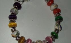 Pandora Charm Bracelets. Made of European Charms and spacer beads. Numerous lengths to fit different sizes.
Different colors Porcelain & Cats Eye beads with .925 SS core lining. Bali style spacer beads.
Pricing starts at $25. for the shortest length, up