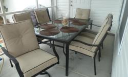 Brand new weather resistant patio furniture bought for our vacation home is too big for our small patio. Tempered glass table (umbrella ready, measures 66x40inches). 2 captains chairs (swivel), 4 chairs. Custom, neutral, very comfortable cushions. Paid