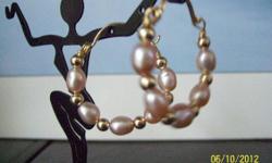 This hoop earring is made of freshwater pearls,gold filled wire balls and 14/20 gold filled wire. Earring can be made with different stone of your choice .just give me a ring or visit me at www.mgjewelry4u.com