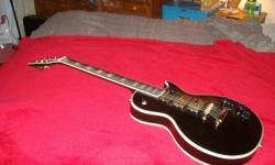 Peter Frampton Les Paul Custom Gibson which is in excellent condition.. Its 3 pick ups. Black with gold pick ups and tunning keys.. Peter Framptons signature is in the ivory in lays of the neck. Price might be slightly negotioble.. It was made in the