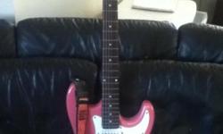 Pink Baltimore electric guitar.
