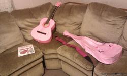 I have a brand new pink accoustic guitar with the case, pck, shoulder strap, and a book to teach cords. I bought this intending to learn to play it but never seem to have the time. This is a smaller guitar and would be great for a woman or child. Please