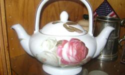 I have 4 tea pots and sets
First one is a ceramic/porcelain birdhouse teapot 7.5" high Teleflora Gift excellent condition asking $15
Second is a ONE PERSON TEA POT CUP SET with saucer. pink with a floral design asking $20
Third is a double spout / chamber