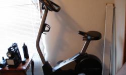 Exercise bike with advanced console. Distance, time you've ridden, speed, as well as calories from fat and regular calorie meters. Readout of peddling pace and the tension for your individual needs. Has a heart rate monitor on the console as well as a