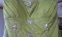 Be the Belle of the Prom in this beautiful dress. Bodice is embellished with gorgeous, eye catching rhinestones. Figure flattering and guaranteed to make you feel like a Princess on your special night. Size 16. Only worn once and this dress is in