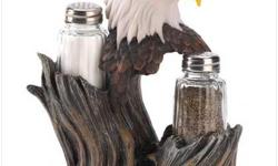 13785 SAVE 15% "PROUD EAGLE SHAKER SET" Whether you?re a proud patriot or a lover of nature?s majestic beauty, this sculptural shaker is truly something special.
A faux burl wood base keeps plenty of salt and pepper ready for seasoning your favorite