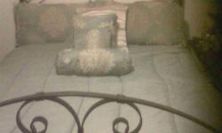 Wrought Iron Queen Size bed with headboard and foot board