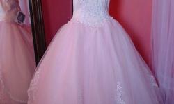 Beautiful P.C. Mary's pastel pink Ball Gown, halter top beaded throughout! Size 14 . Come in before December 31 and get any one accessory at 30% off!! Just mention this ad.