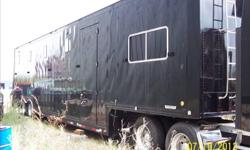 1994 t600 semi with large sleeper , 20kw diesel gen , air compressor , 48 ft kentucky trailer with lift gate , inside car lift ,
lista cabinets both sides , lounge w/ac , 48 ft pro awning , all tires new toyo , trailer and truck all black with polished