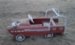Childs peddle car-1950's Radio Flyer Fire Engine. Has all accessories; ladder, bell and head ligh assembly, igniion key.