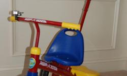 Radio Flyer Deluxe Steer and Stroll Trike. Excellent condition, for a boy or girl.