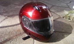 I have a burgundy or red color (depending on who you ask) motorcycle helmet, that is a size Large. It is DOT and Snell approved, it has a manufacture date of Oct 2005 on the inside. I can not find the name of the company who makes it. It has scratches on