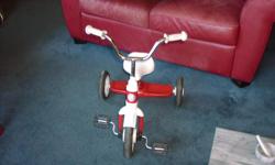 Adorable Radio Flyer tricycle in great condition. Red and white, and ready for you child's tricycle adventures!