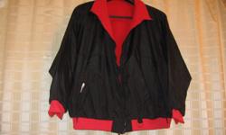 Roamans reversable jacket with pockets, and zipper front, this jacket is lightweight but keeps you amazingly warm. Size 2X, in good shape, will repel light rain but not a downpoor, its not a raincoat. Payed $10.00 for it, asking $5.00 cash, first offer
