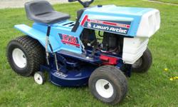 10 H.P. 36 inch cut Lawn Artist Riding Mower. Rear discharge. New paint, new battery, repairs done, runs good, looks good.