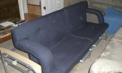 Rollaway extra bed doubles as a "Loveseat". When not using, folds up nicely.