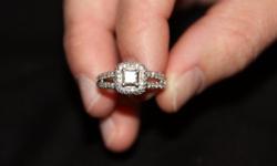 2.5 TCW on engagement ring with a .75 TCW center stone, 14K white gold. Valued at $3,000. Wedding ring is also 14K white gold with 3 rows of diamond chips. Wedding ring is valued at $500. Size 7 engagement ring, size 6 1/2 wedding ring. Must see to