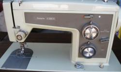 Nice Sears Kenmore sewing machine in cabinet with fold out work area,fantastic shape,works excellent