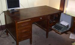 Solid Wood with typewritter side drawer 30" height, 32" depth, 60" long above average condition 3 drawers left and center drawer, missing lap drawer, all drawers in good working order