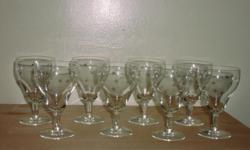 Very pretty set of 8 wineglassed with an etched star pattern in terrific condition. No chips, cracks or fleabites. Measures approximately 5 1/4 inches tall by 3 1/4 inches across. I also have a matching set of cordial glasses in the same pattern.