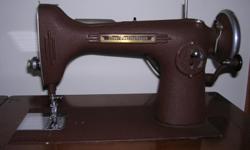 Metal Westinghouse Sewing machine in original wooden cabinet. Comes with box of attachments (different foot petals, etc.). Cabinet is in good shape, but the finish has some scratches. I'm not a sewer, so I haven't tried the machine other than to know it