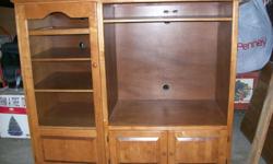 The entertainment center is 5ft. wide with a 34 inch opening.&nbsp; It has doors and shelf along the bottom and a gless door on the side with shelves in it for you accessories.&nbsp; It is solid maple and a very nice color.&nbsp; It is in very good
