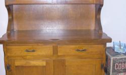 In good condition. Two drawer, four door, two doors have glass. 4 foot wide, 65.5 inches high, 20 inches deep.