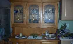 Excellent condition solid oak pieces. Hutch has cupboards and drawers, table is pedistal style with butterfly leaf. Comes w 6 chairs. Call Millie at 561-992-1071
